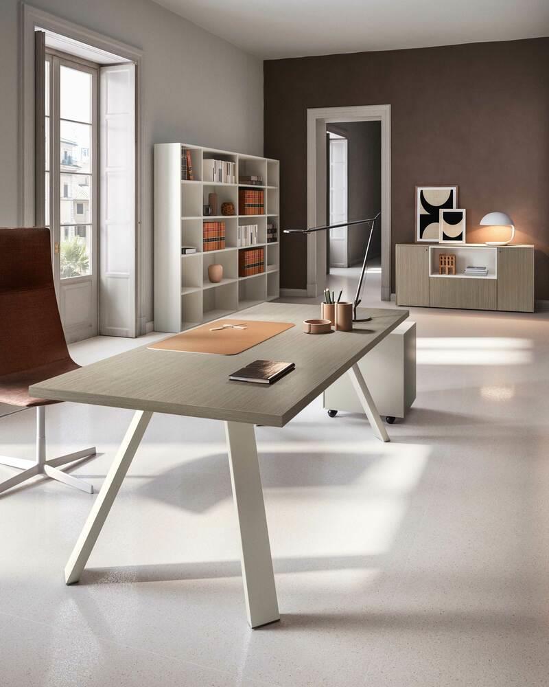 Tavolo riunioni di colore Rovere Twist con cassettiera, gambe disponibili in NERO o BIANCO, con piano il nobilitato melaminico.
